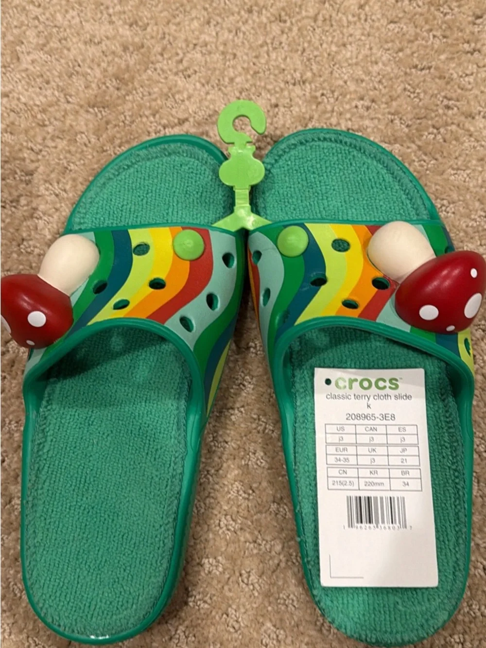 CROCS Kids Teal Slide Sandals with Rainbow Stripes